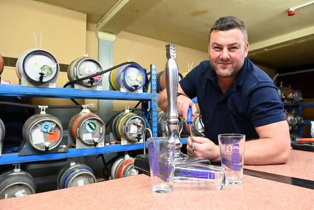 Steven Gibson from Hartlepol Round Table getting ready for the beer festival. Picture by FRANK REID
