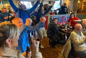 Fans at The Park Inn celebrate England scoring in their World Cup match against Iran.