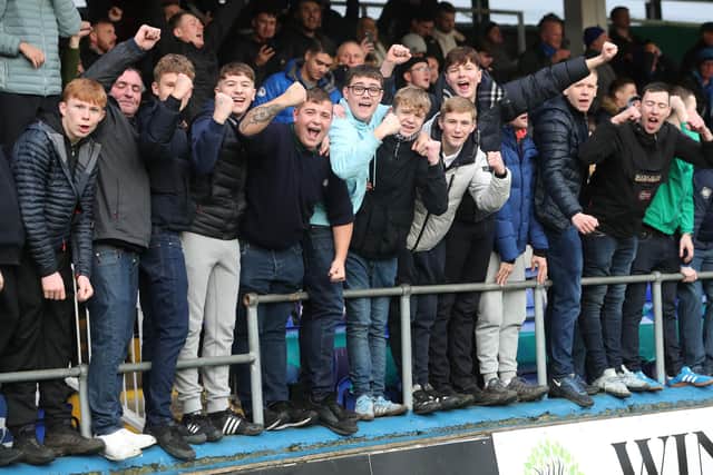 Hartlepool United fans celebrate after the club's third round FA Cup victory over Blackpool in January 2022.