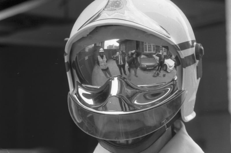 A fireman from Lothian and Borders Fire Brigade models the new experimental helmet with reflective visor at Lauriston fire station in Edinburgh, April 1987.