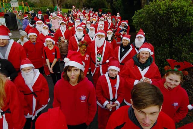 Runners waiting for the start off the annual Santa Run held in aid of Alice House Hospice held in Ward Jackson Park.