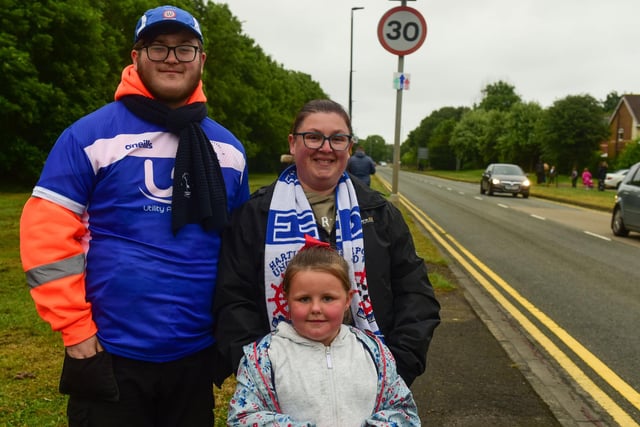 Fans stand ready for the Hartlepool United open-topped bus parade at the junction of The Coast Road and West View Road in 2021.