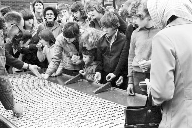 Rolling pennies was a popular pastime at this garden fete on Sunderland's Red House Estate in 1979.