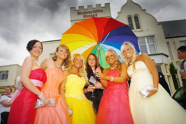 Pupils are prepared for the rain with their colourful umbrella in 2008.
