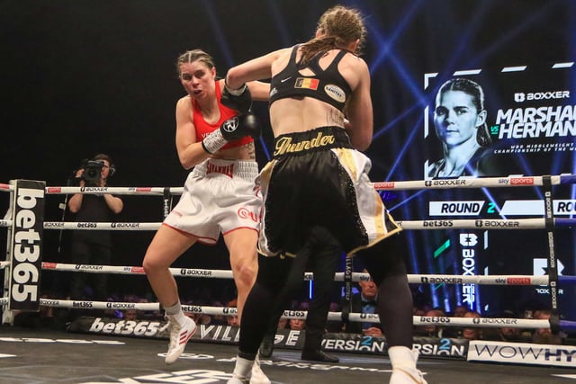 Femke Hermans fires back on Savannah Marshall during their WBO middleweight title fight in Newcastle. Picture by Martin Swinney