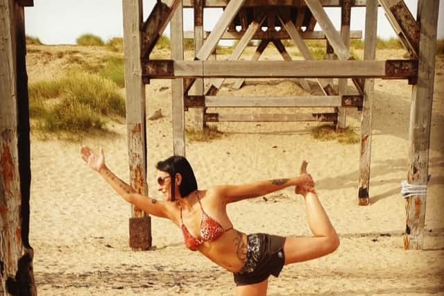 Cristina Moreira practicing yoga at Steetley Pier, the Headland, Hartlepool.
