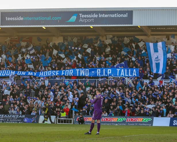 Hartlepool United's fans unveil a tribute to a fellow supporter who recently lost his life. (Photo: Mark Fletcher | MI News)