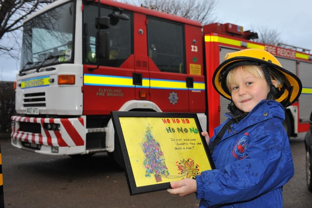 Throston Primary School pupil Taylor Guttridge stands in front of the fire engine she arrived to school in, in 2012.