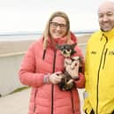Reunited. Nikki Featherstone and her Chihuahua 'Remy' pictured with Hartlepool RNLI crewmember Ken Hay./Photo: RNLI/Tom Collins