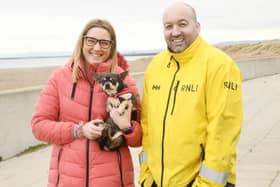Reunited. Nikki Featherstone and her Chihuahua 'Remy' pictured with Hartlepool RNLI crewmember Ken Hay./Photo: RNLI/Tom Collins