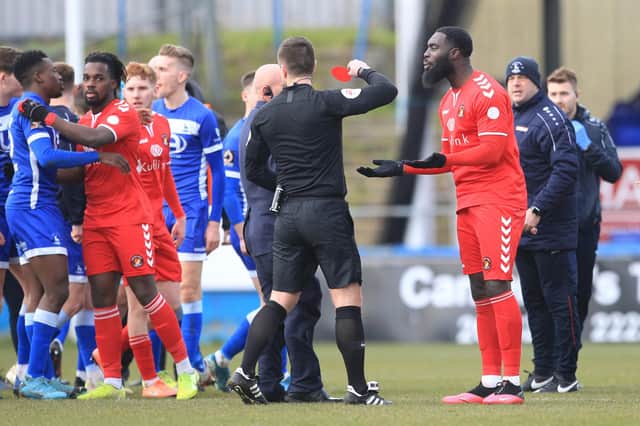 Referee Aaron Jackson shows Ebbsfleet United's Ayo Obileye a red card after the Vanarama National League match between Hartlepool United and Ebbsfleet United at Victoria Park, Hartlepool on Saturday 7th March 2020. (Credit: Mark Fletcher | MI News)