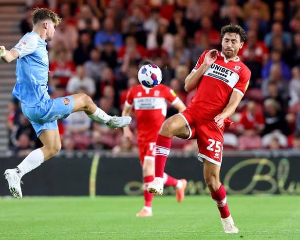 MIDDLESBROUGH, ENGLAND - SEPTEMBER 05: Dennis Cirkin of Sunderland is challenged by Matt Crooks of Middlesbrough  during the Sky Bet Championship match between Middlesbrough and Sunderland at Riverside Stadium on September 05, 2022 in Middlesbrough, England. (Photo by Nigel Roddis/Getty Images)