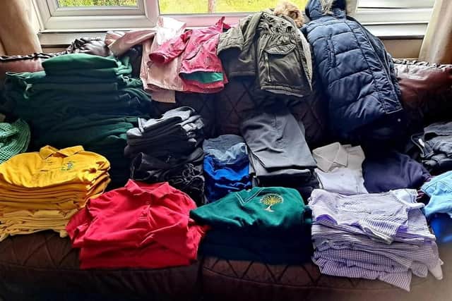 Unwanted school uniforms have been donated and are being sorted ready for delivery or collection.