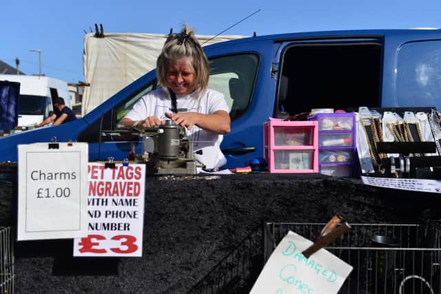 A trader prepares her stall in September last year, when the market reopened after nearly six months.