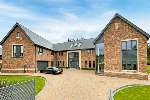 This large detached home has six bedrooms and six bathrooms.