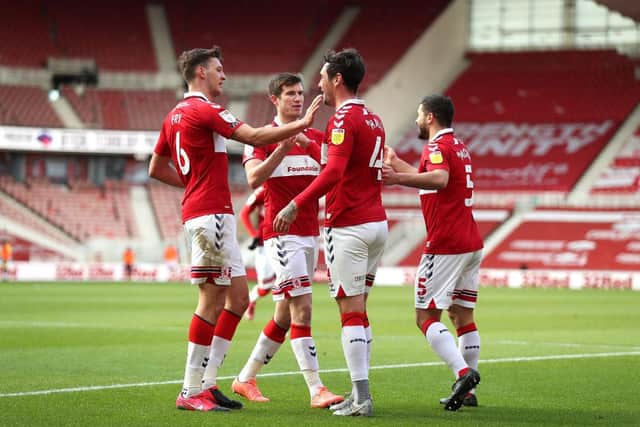 Grant Hall of Middlesbrough celebrates with teammates after scoring against Stoke.