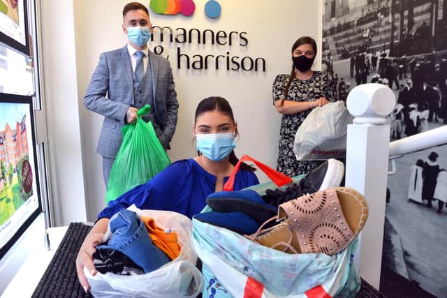 Manners and Harrison staff (from left) Luke Weighill, Lottie Appleby and Leonie Swinborne with donations for Leanne Taylor and her four children who have lost everything in a house fire.