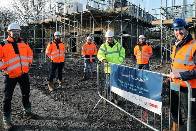 Acland Homes’ Stephen Litherland, far right, with construction partners.
