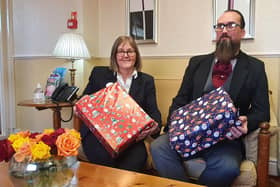 Julia Masshedar and Scott Mallinson at Masons Funerals with shoe boxes for Operation Christmas Child.