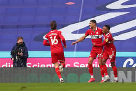 READING, ENGLAND - FEBRUARY 20: Ashley Fletcher of Middlesbrough celebrates with team mates Darnell Fisher and Jonny Howson after scoring their side's first goal during the Sky Bet Championship match between Reading and Middlesbrough at Madejski Stadium on February 20, 2021 in Reading, England. Sporting stadiums around the UK remain under strict restrictions due to the Coronavirus Pandemic as Government social distancing laws prohibit fans inside venues resulting in games being played behind closed doors. (Photo by Catherine Ivill/Getty Images)