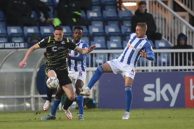 Ryan Loft of Scunthorpe United in action with Hartlepool United's Gary Liddle. (Credit: Mark Fletcher | MI News)