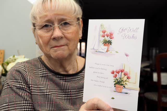 Councillor Loynes with one of the many get well soon cards she has received. Picture by FRANK REID