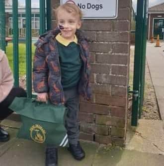 Noah looks so happy in his uniform and his school bag in hand.