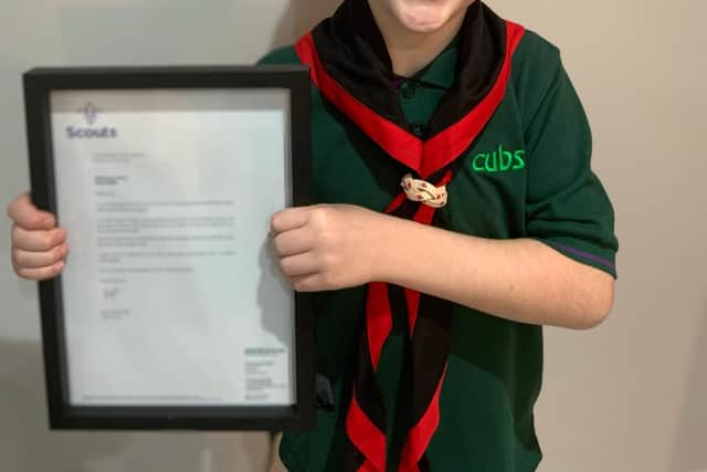 Harry with his letter from Chief Scout Bear Grylls.