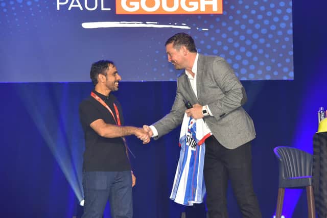 Hartlepool businessman Paul Gough with a lucky winner of a Hartlepool United shirt.