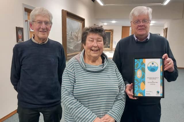 From left, Hartlepool Fairtrade Steering Group members Keith Gorton, Chris Eddowes and Martin Green, holding their Fairtrade Town certificate.