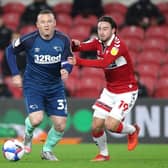 Middlesbrough's Patrick Roberts in action against Derby's Wayne Rooney.