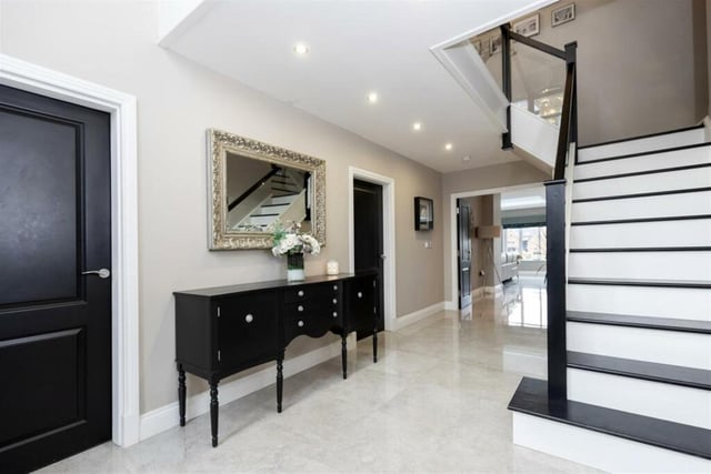 This property has a large and modern entrance hall featuring a bespoke staircase and large cloakroom. The hall leads off into two reception rooms, a cinema room and an open-plan kitchen, diner and family area.