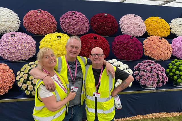 John (middle) with wife Allyson and friend Terry who helped him with the award-winning display.