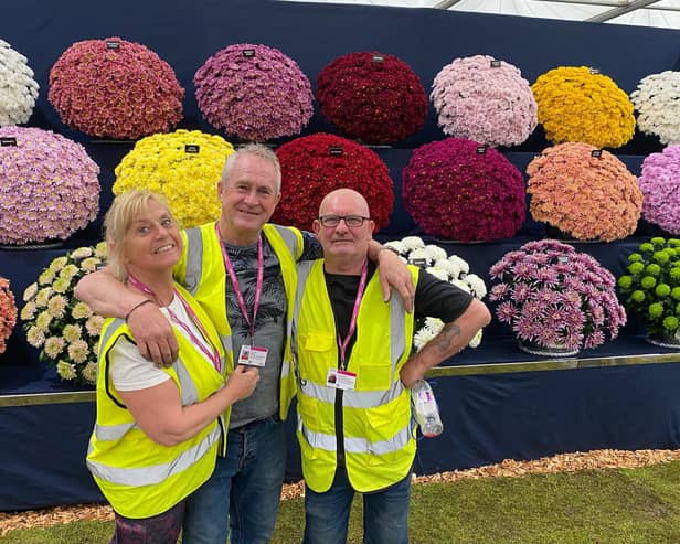 John (middle) with wife Allyson and friend Terry who helped him with the award-winning display.