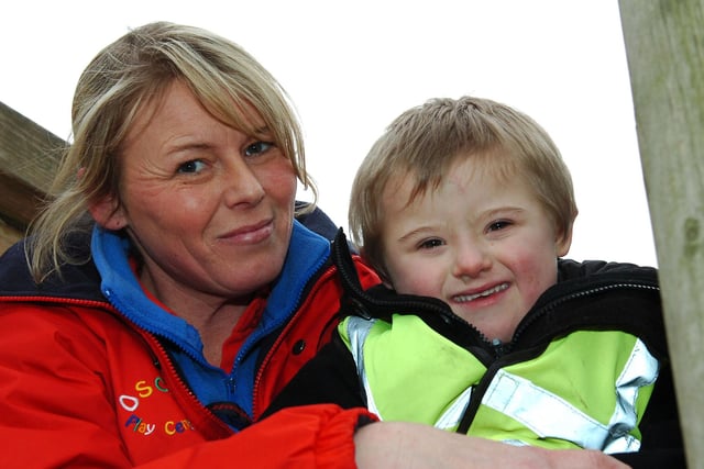 Oscar Playgroup special needs assistant, Lisa Collins, takes Leighton Berwick on the frame at Summerhill in 2013.