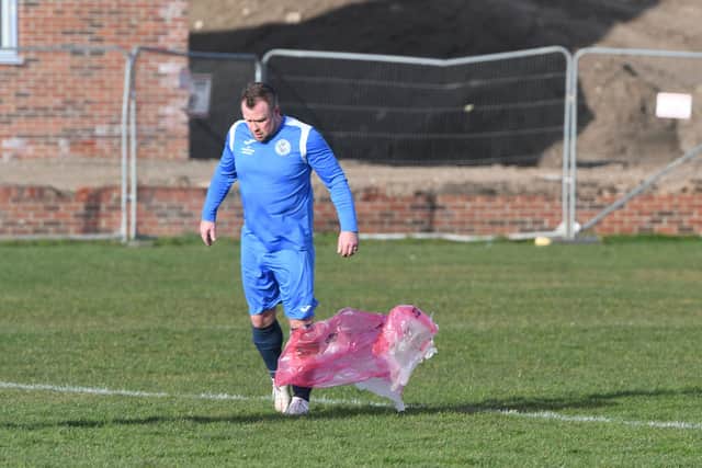 A Hartlepool Cricket Club Over 40s player struggles with debris blowing across the pitch at Hartlepool's Brierton Community Sports Centre on Saturday.