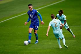 Wigan striker Kieffer Moore is expected to join Cardiff City this week.