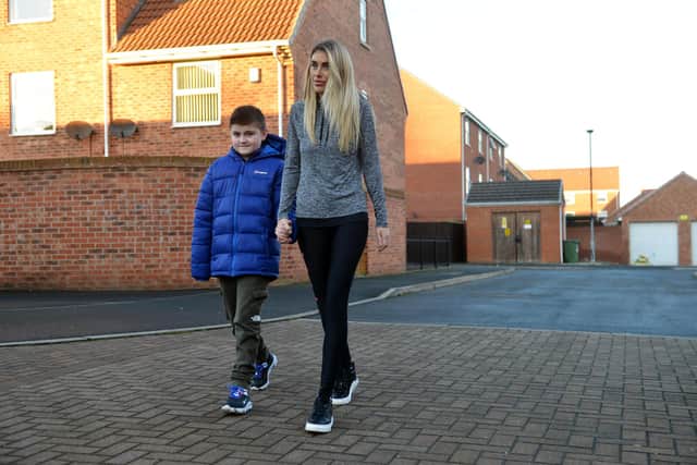 Craig Adair, with mum Sophie Young, is to take part in a sponsored walk.