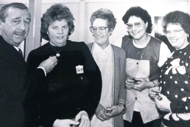 A late 1980s photo showing long-serving workers picking up award. Recognise them?