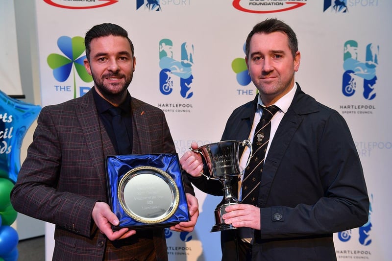 Volunteer of the year Liam Lester, right, receives his award from Dan Garthwaite. Picture by FRANK REID