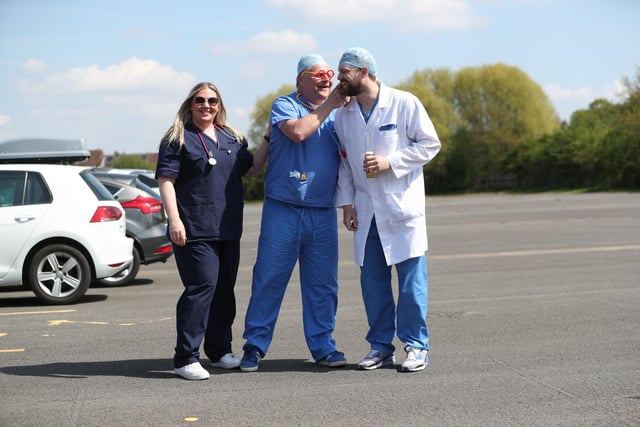 Hartlepool United supporters arrive in Scunthorpe dressed as doctors and nurses. (Credit: Mark Fletcher | MI News)
