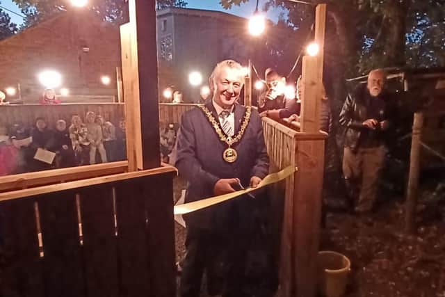 The Ceremonial Mayor of Hartlepool Cllr Brian Cowie cuts the ribbon on the new fire pit area.
