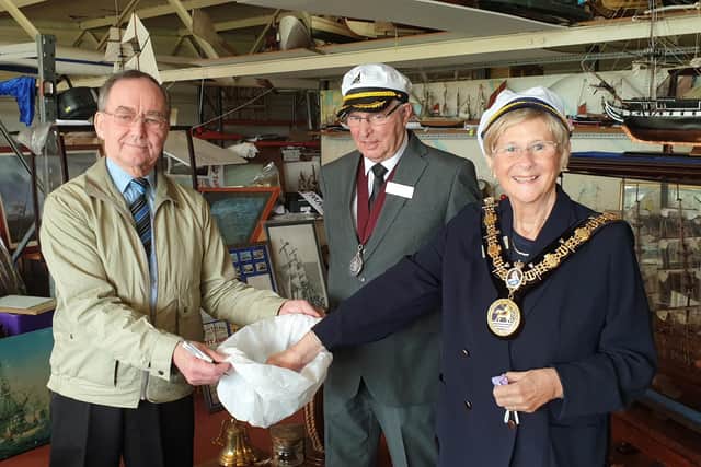 The Ceremonial Mayor of Hartlepool Cllr Brenda Loynes makes the draw for the Trincomalee model with her consort Cllr Den Loynes and Hartlepool Marine Supplies owner Cedric Williams, left.