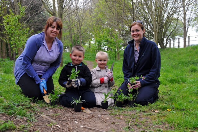 Emma Wright, Max Bainbridge and Parin Wilding, from Footprints Nursery, get planting alongside Jo Haskett, from the Wild Green Space Project, at the Family Wood in 2011.