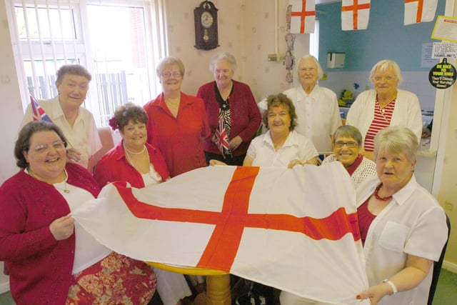 All in red and white at Springwell Flats in 2009. In the picture are Sheila McKenzie, Elsie Hetherington, Moira Pattison, Jean Altringham, Jennie Smith, Maureen Hunt, May Wildberg, Jean Carter, Eileen Connolly, and Ruby Bradley.