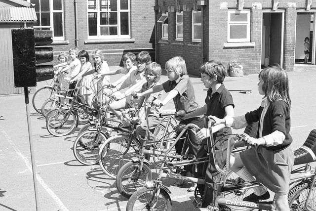 Pupils at Grangetown Junior School lined up at mock traffic lights for cycling proficiency instruction. Who remembers this from 1976?