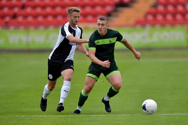 Hartlepool United's David Ferguson is closed down by Gateshead's Greg Olley during a pre-season friendly at the International Stadium. Picture by FRANK REID