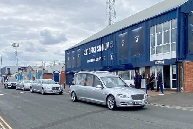 The funeral cortege of former Hartlepool United player Hughie Hamilton pauses outside the Suit Direct Stadium as staff pay their respects. Picture by FRANk REID