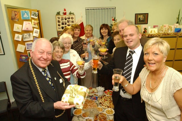 Volunteers who gave up their time to help others at Christmas in 2005 but who can tell us more about this photo?