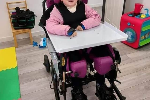 Talia Foster who has curvature of the spine but her condition has been eased by the arrival of a specialist new chair.
